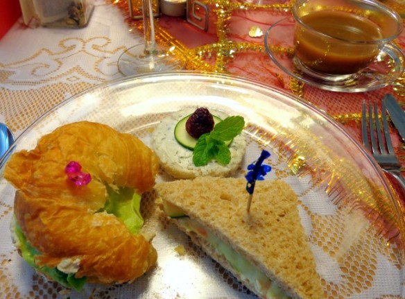 Lady T.'s curried chicken salad croissant, Lady B.'s mint chutney and cucumber, and carrot and cucumber sandwiches